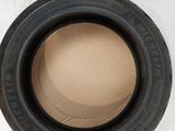 a close up of a tire on top of a cardboard box
