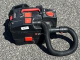 a black and red blower sitting on the ground