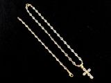a gold rosary necklace with a cross on a black background