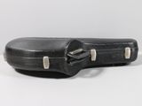a guitar case sitting on a table with a white background