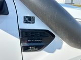 a sticker on the side of a white truck with a sticker on it