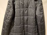 the back of a gray jacket with a hood on it