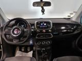 the interior of a small car with a steering wheel and dashboard