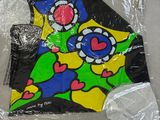 a kite that is wrapped in plastic on a table