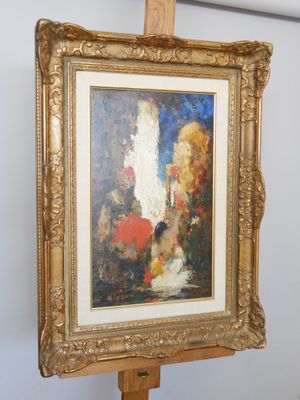 une image d'un tableau sur un chevalet dans une pièce
