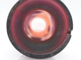 a picture of a red and black object on a white surface