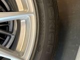 the tire of a car is shown on the floor next to the wheel