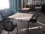 a room with a table and chairs in it