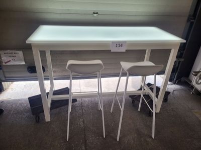 two stools and a table in a garage