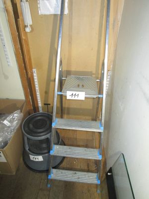 a ladder that is leaning against a wall in a room
