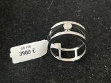 a close up of two rings on a black surface with a price tag
