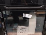 an image of a microwave oven sitting on top of a pallet