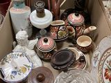 a box full of assorted vases and plates