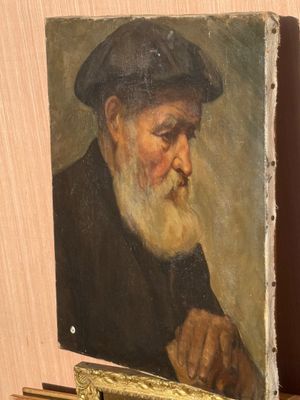 painting of an old man with a beard and a hat on a shelf