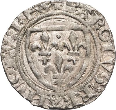 a silver coin with an image of a coat of arms on it