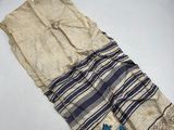 a close up of a piece of cloth with a flower on it