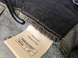 the label on the back of a pair of jeans shows the size of the jeans