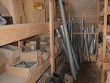 a room filled with lots of boxes and metal pipes
