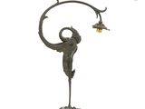 an image of a bronze statue of a woman holding a lamp