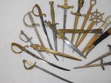 a lot of different types of scissors on the table