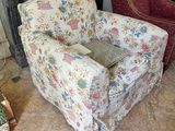 a chair that is sitting in front of a fire place