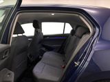 the back seat of a car with the door open in a showroom