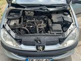 a car with its hood open and the engine in the trunk