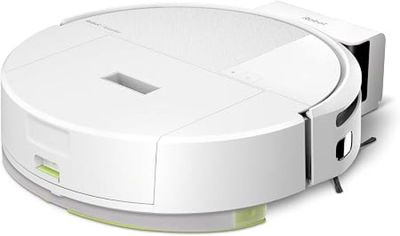 gros plan d'un aspirateur robot sur une surface blanche