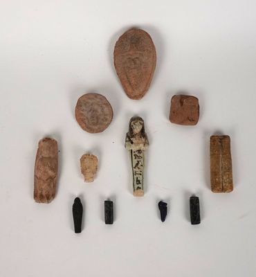 an image of a collection of ancient artifacts including a scarra and other items