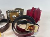 a lot of belts that are sitting on a table