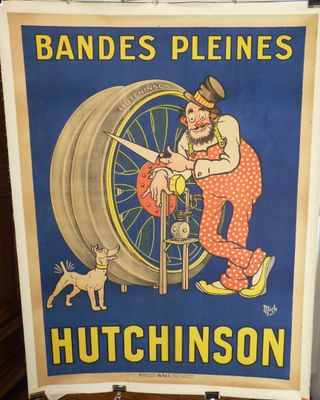 une vieille affiche représentant un homme travaillant sur une roue en compagnie d'un chien