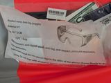 a red bag with a pair of glasses and money in it
