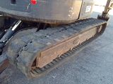a close up view of a tractor that is parked on the street