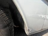a close up of a tire on a white truck