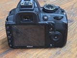 a camera sitting on a wooden table on a table