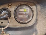 a close up of a car dashboard with a keychain on it