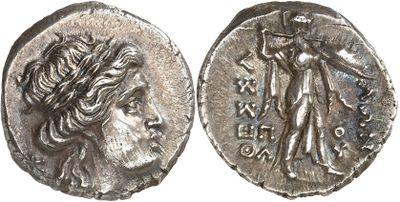 a silver coin with an image of a woman on it