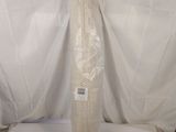 a large white vase sitting on top of a white sheet