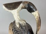 a close up of a sculpture of a bird on top of a helmet