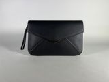 a black leather clutch bag with a gold clasp
