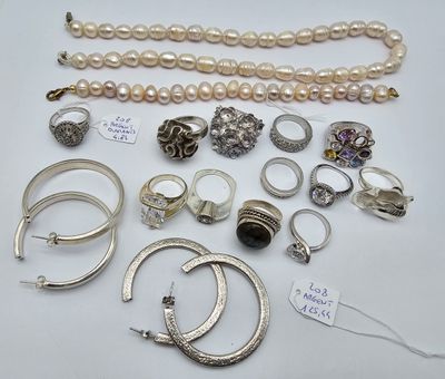 many different types of jewelry on display on the table