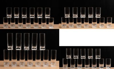 many shot glasses lined up on a shelf