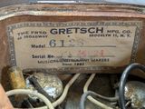 a label on the back of a car that says gretsch