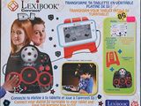 a box with a picture of two children playing with a computer