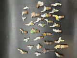 a lot of small figurines that are on a table