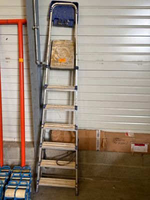 a ladder that is leaning against a wall in a garage