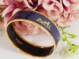 an image of a close up of a ring with flowers in the background