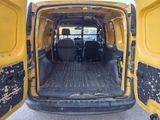 a yellow van that is parked in the parking lot