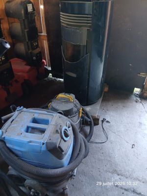 an image of a vacuum and other equipment in a garage