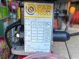 someone is using a blender to make a smoothie in a store